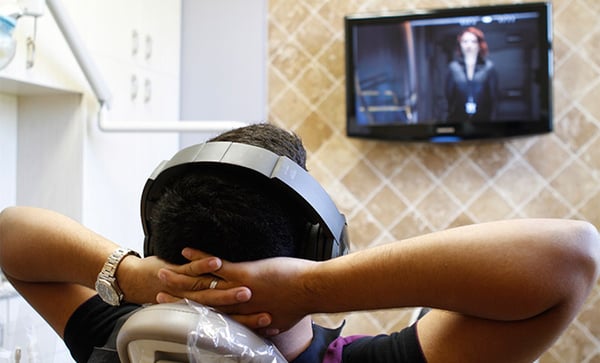 dental patient watching tv while being worked on